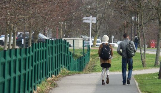 Two students walking through campus