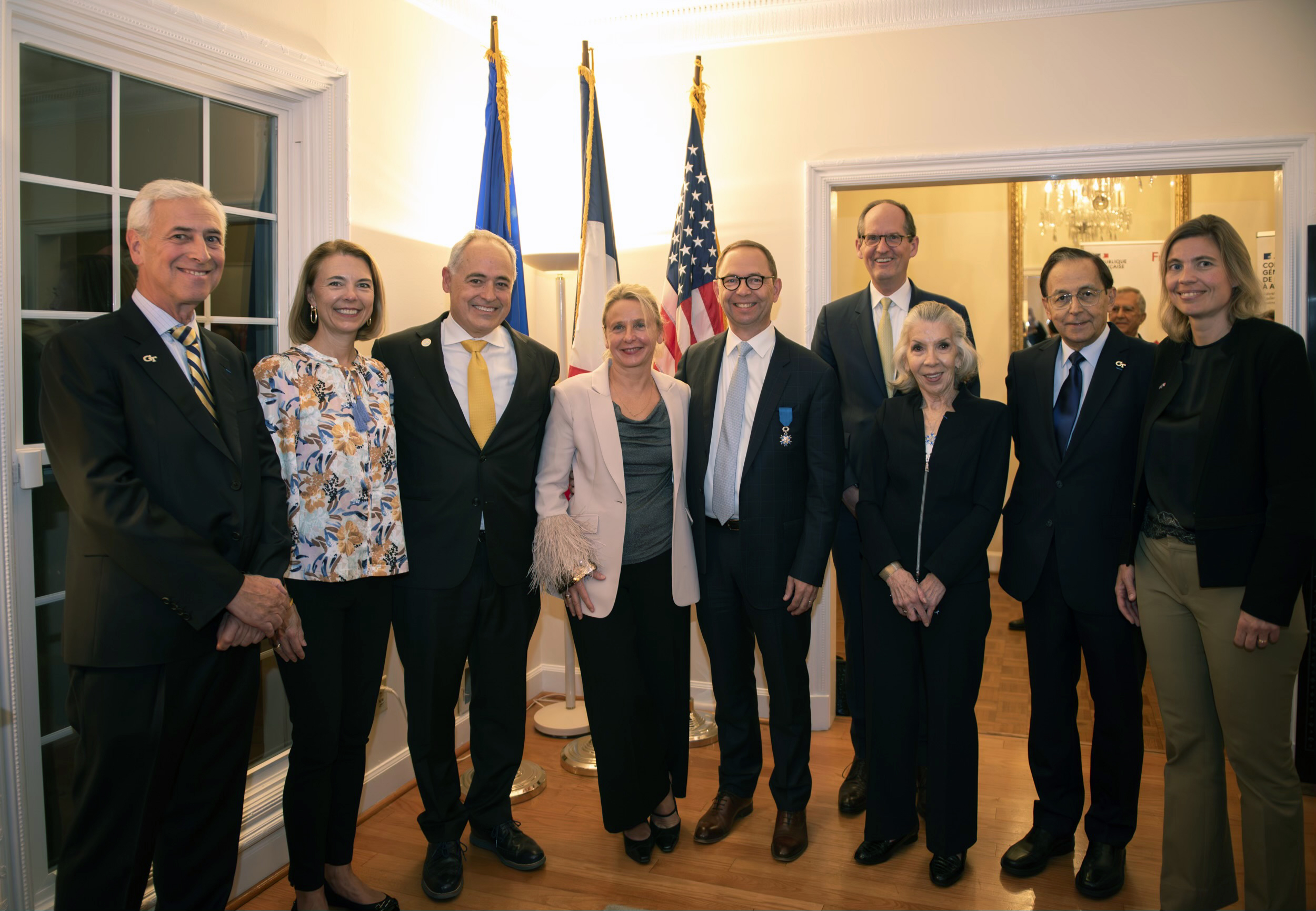 Bernard Kippelen receiving the Knight of the French National Order of Merit on Nov. 6, 2023 at the Residence of France in Atlanta. In the photo are (L-R): Yves Berthelot, Beth Cabrera, Ángel Cabrera, Virginie Kippelen, Bernard Kippelen, Steve McLaughlin, Marta H. Garcia, John McIntyre, and Anne-Laure Desjonquères. 
