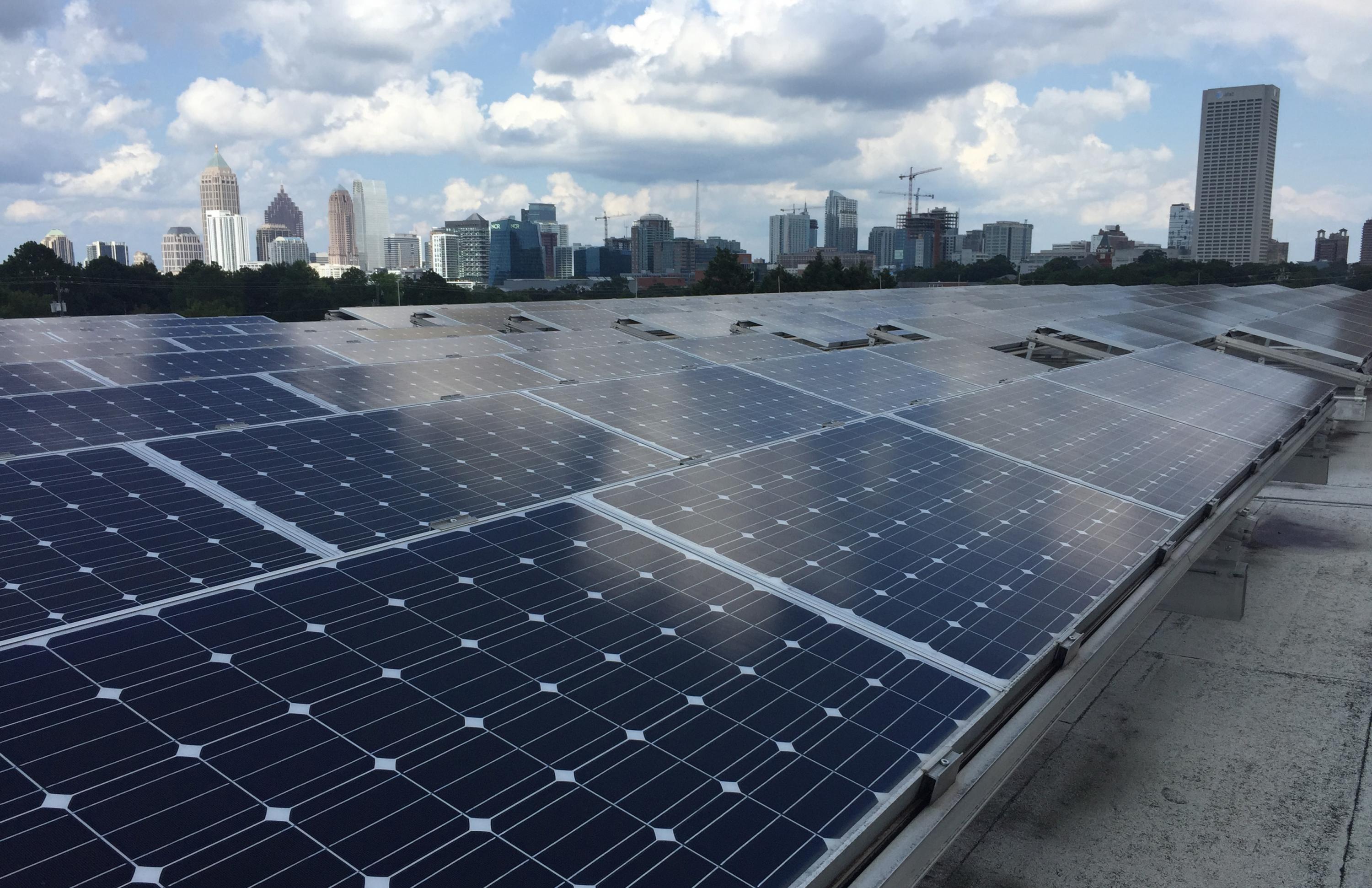 Rows of photovoltaic panels are shown atop a building on the Georgia Institute of Technology campus in Atlanta. A new technique under development could potentially improve the efficiency of solar cells. (Credit: John Toon, Georgia Tech)