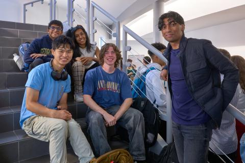 A group of students sits on the stairs at GTE